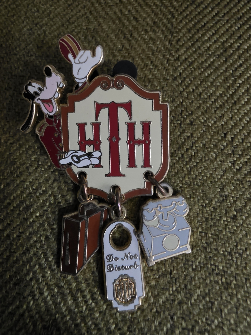 Disney Pluto Hotel Shield Pin — Red, Cream & Gold Accents